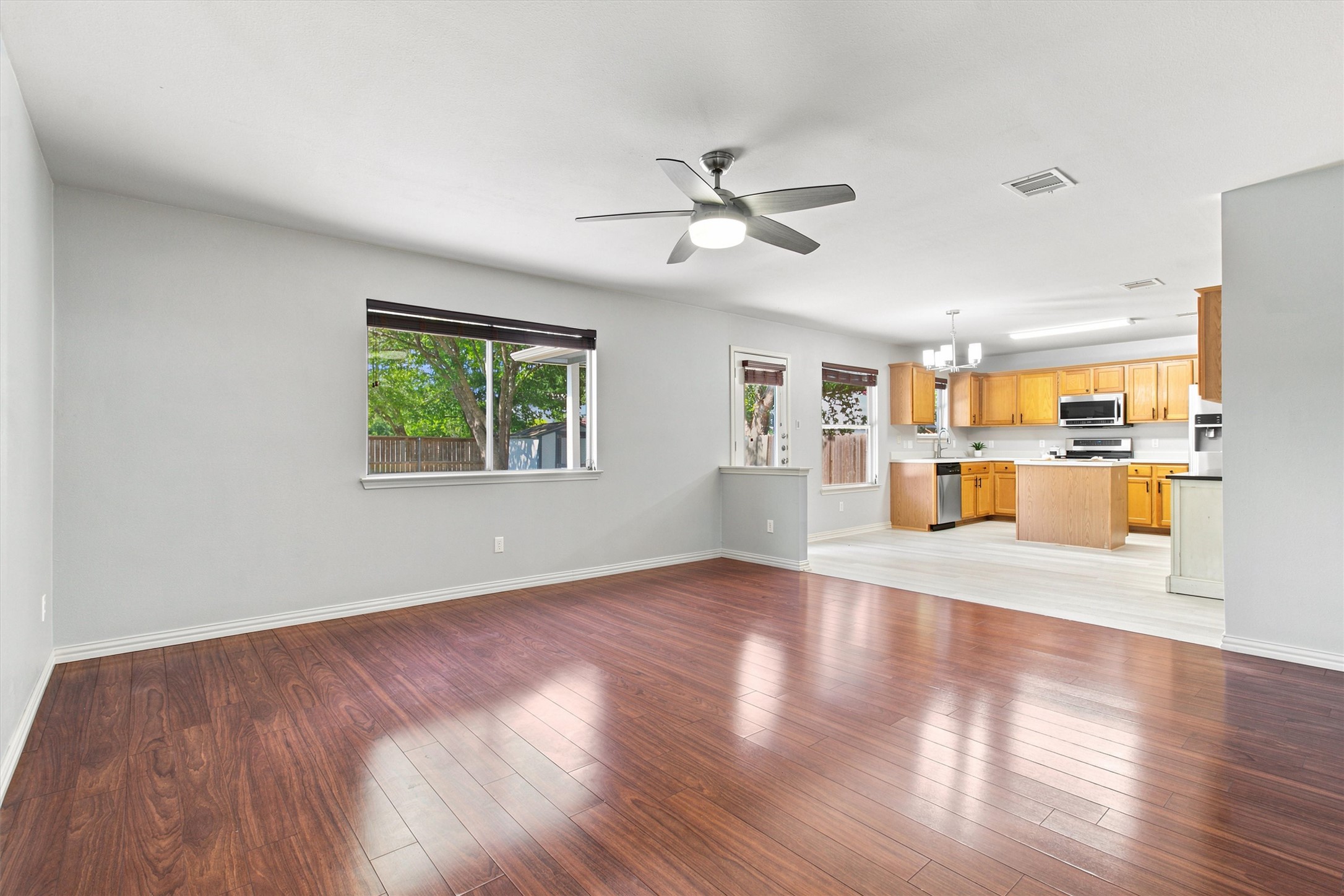 1608 Melibee Trail Austin, TX 78748 - Photo 14 of 23 Gleaming hardwood floors and a spacious open layout flow effortlessly toward the adjoining kitchen.