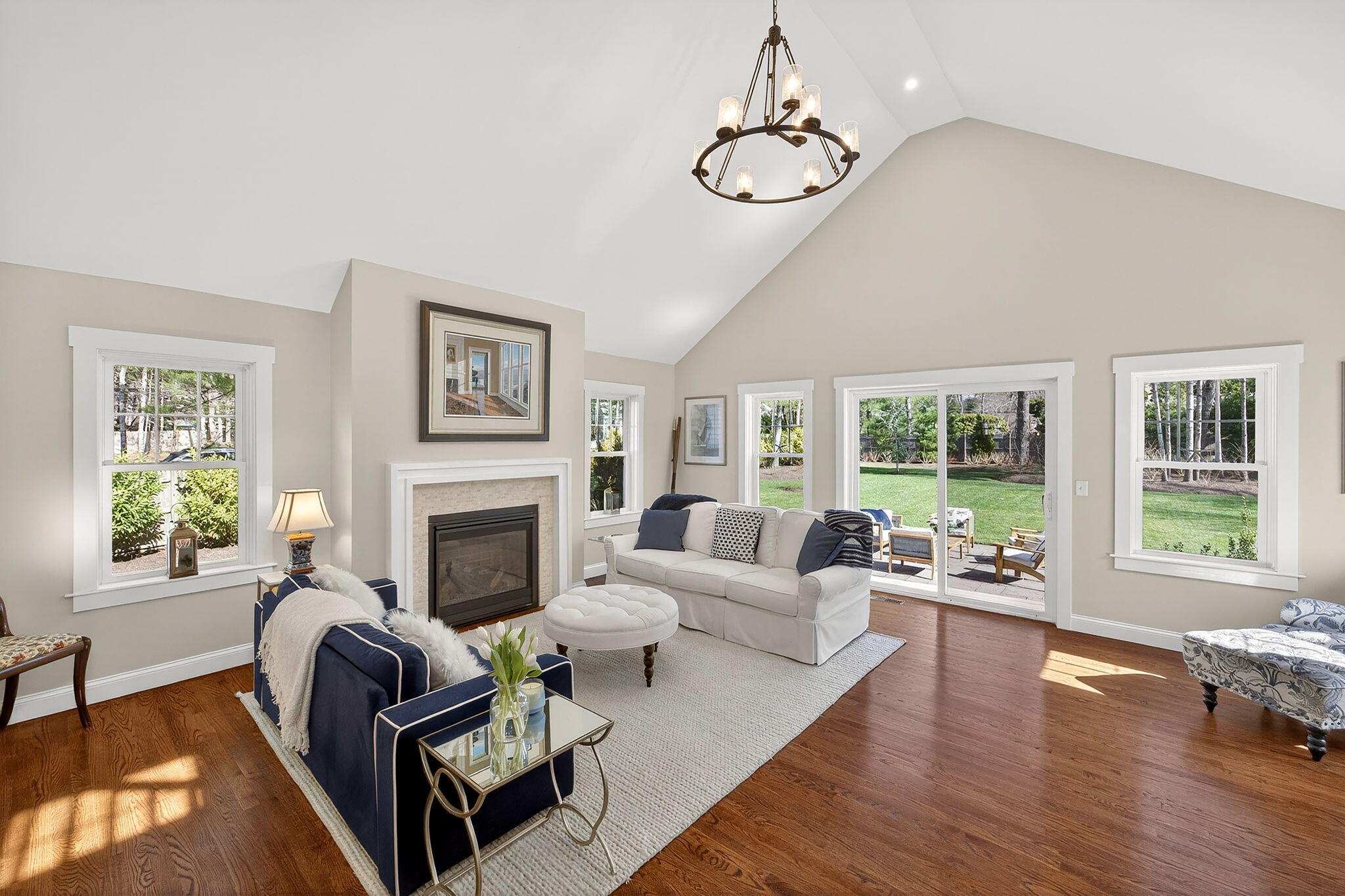 176 Bumps River Road Osterville, MA 02655 - Photo 12 of 54 a living room with furniture and a fireplace