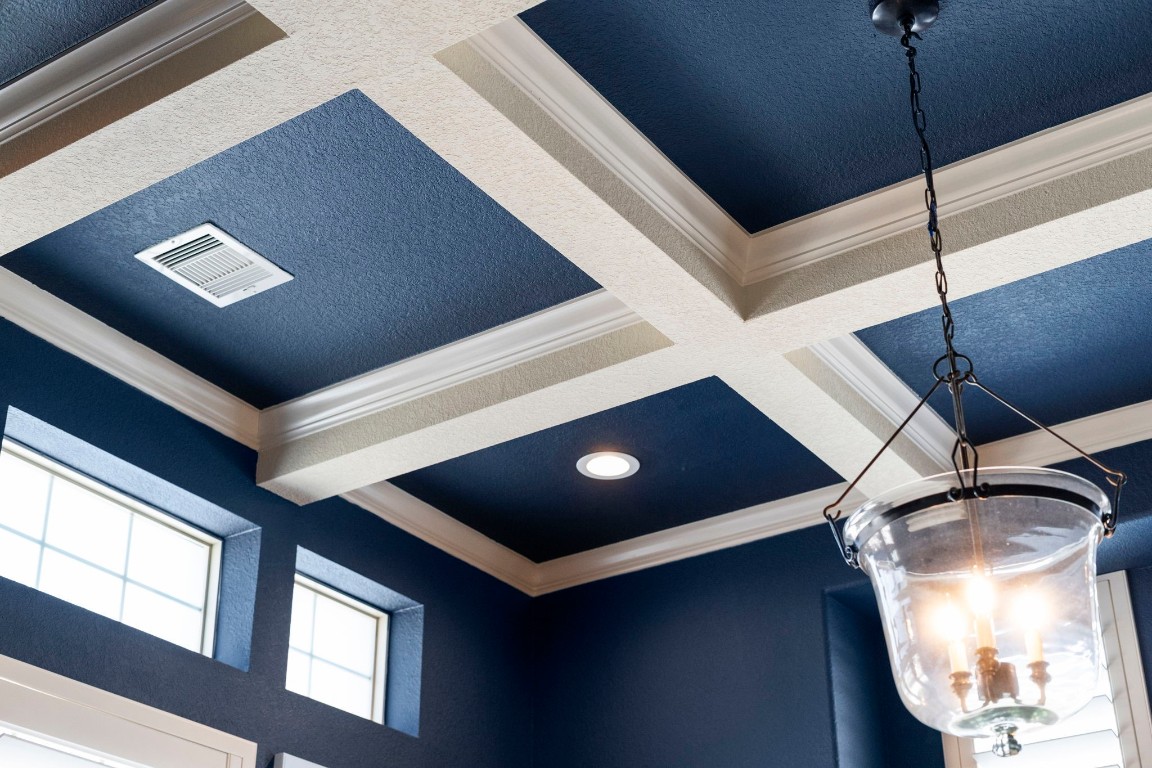 622 Pink Azalea Trail Houston, TX 77079 - Photo 19 of 50 A striking coffered ceiling with contrasting inset panels creates a bold architectural statement, adding depth, dimension, and visual interest.