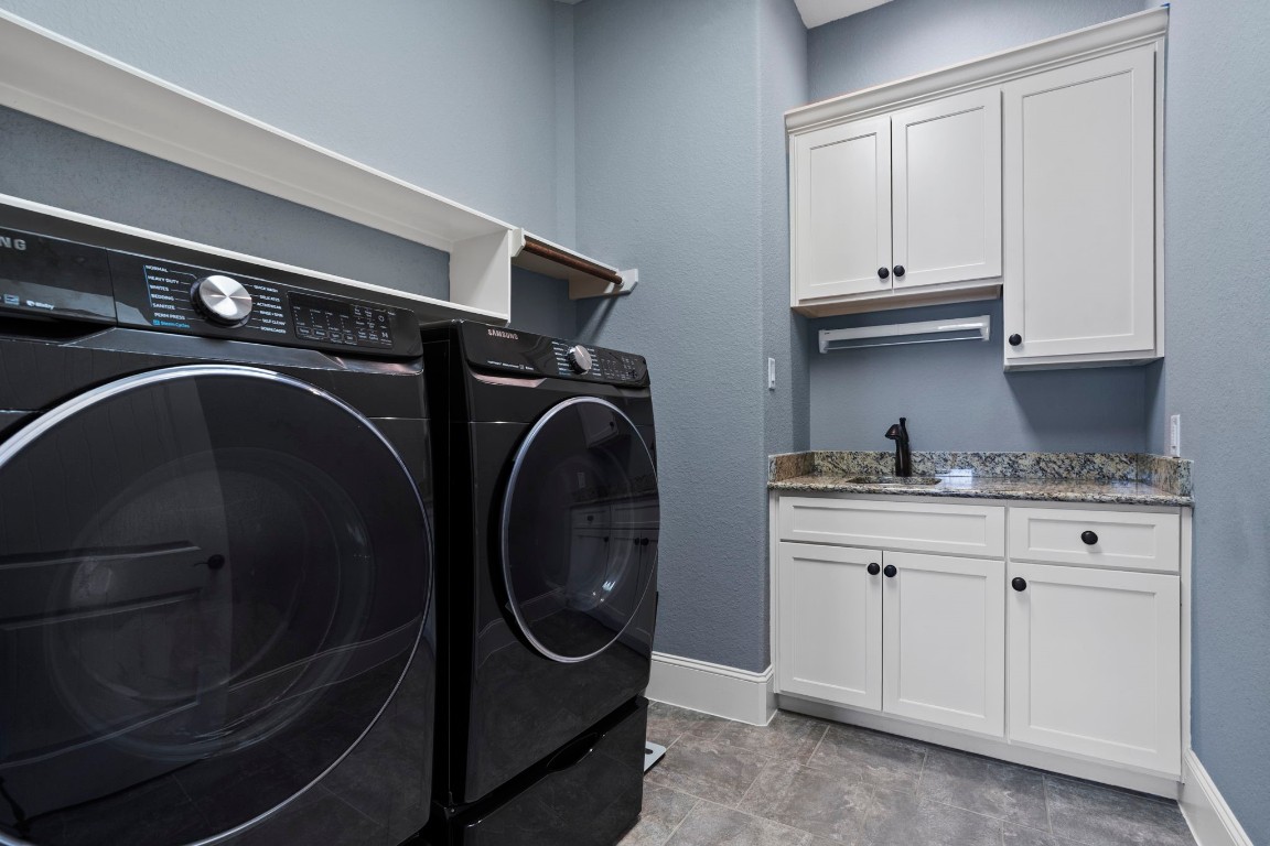 622 Pink Azalea Trail Houston, TX 77079 - Photo 42 of 50 Spacious laundry room with built-in storage and a utility sink.
