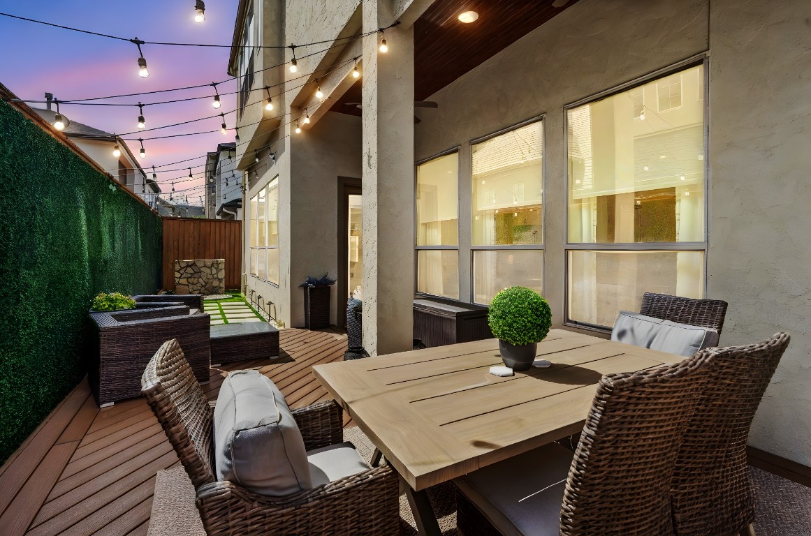 622 Pink Azalea Trail Houston, TX 77079 - Photo 43 of 50 Thoughtfully designed, low-maintenance backyard featuring a patio with dining and living space, tranquil water feature, putting green, and artificial turf.