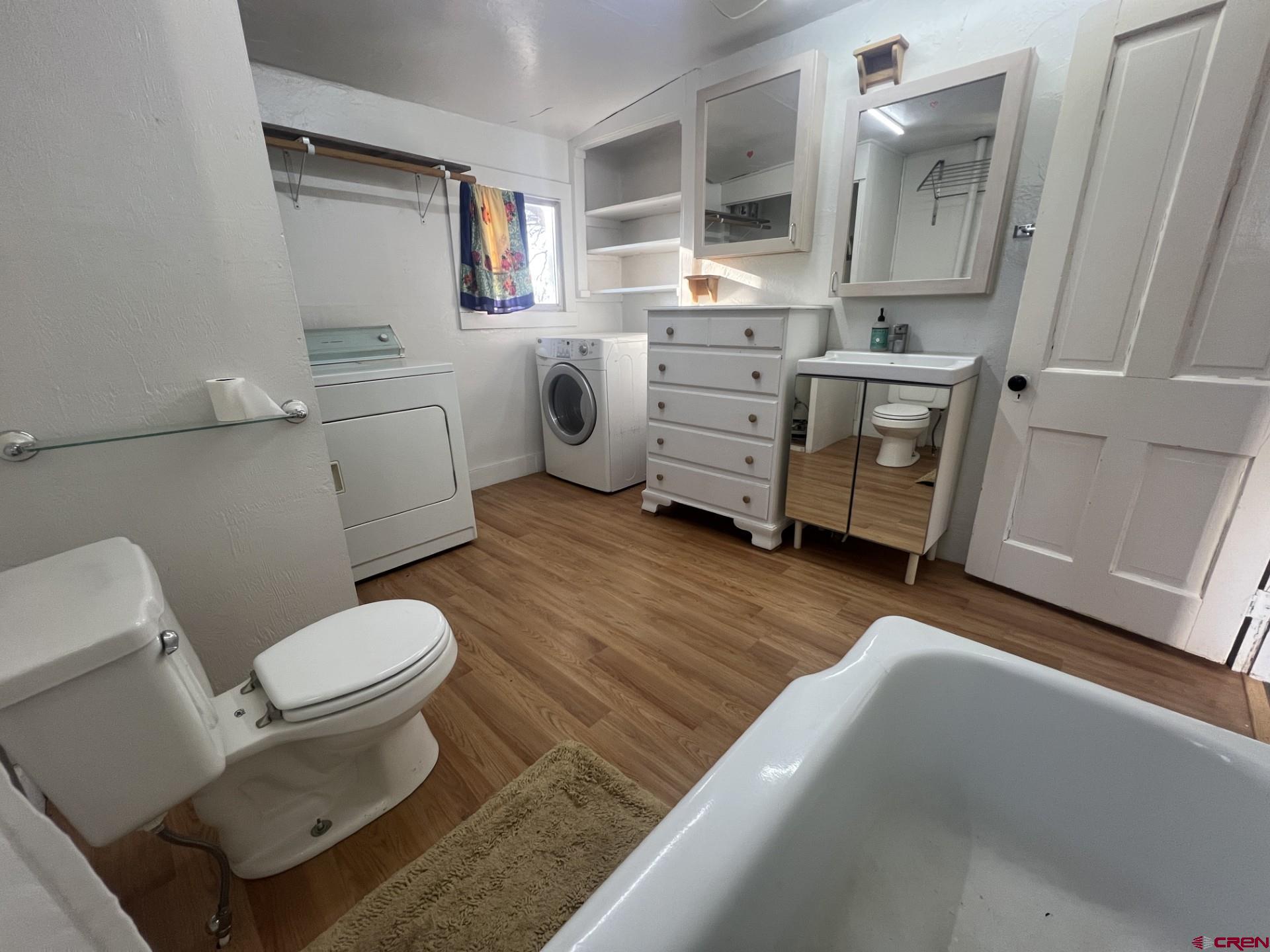 12363 Road 25 Cortez, CO 81321 - Photo 15 of 26 a bathroom with a toilet sink and mirror