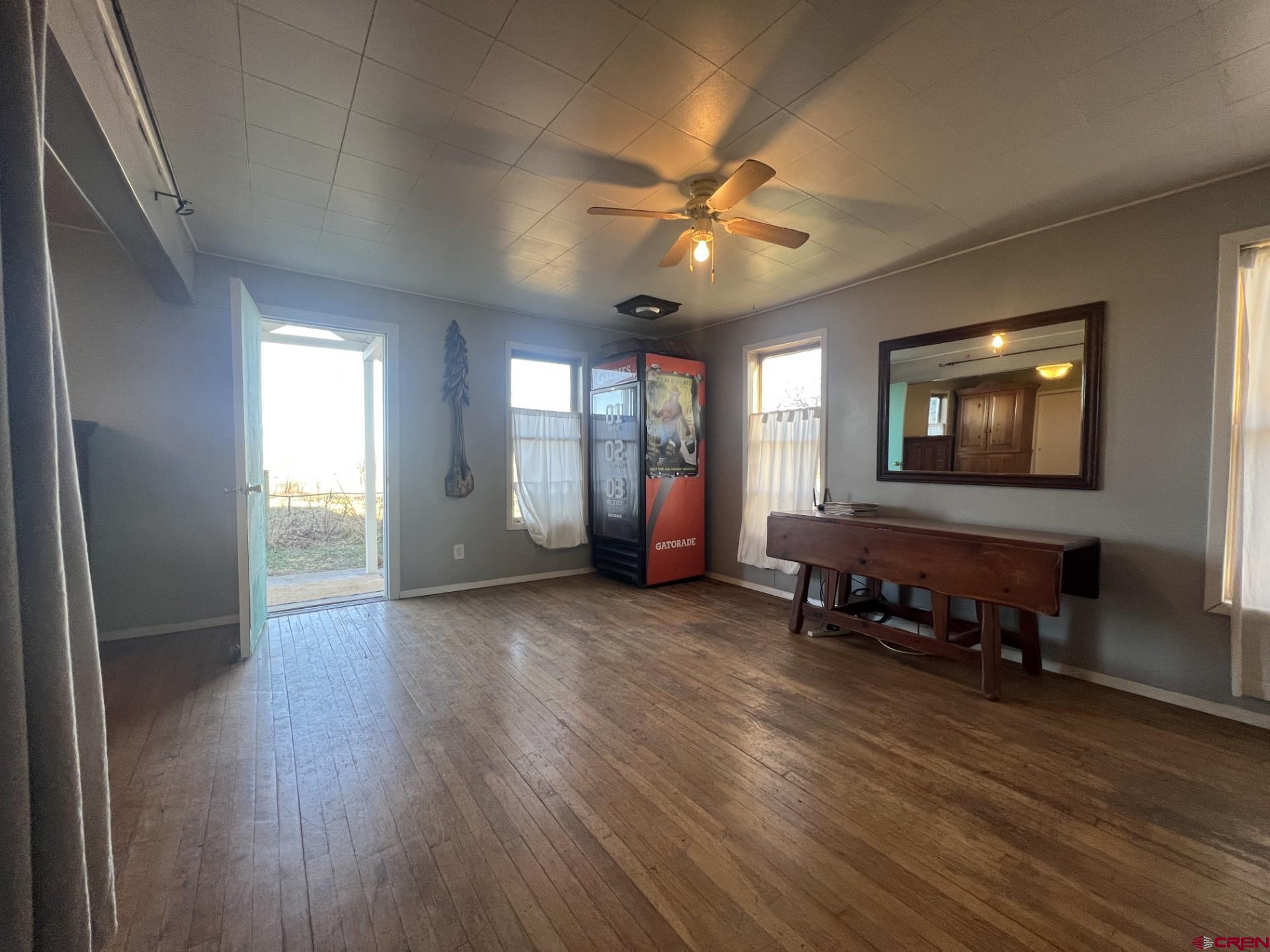 12363 Road 25 Cortez, CO 81321 - Photo 6 of 26 a living room with furniture and a window