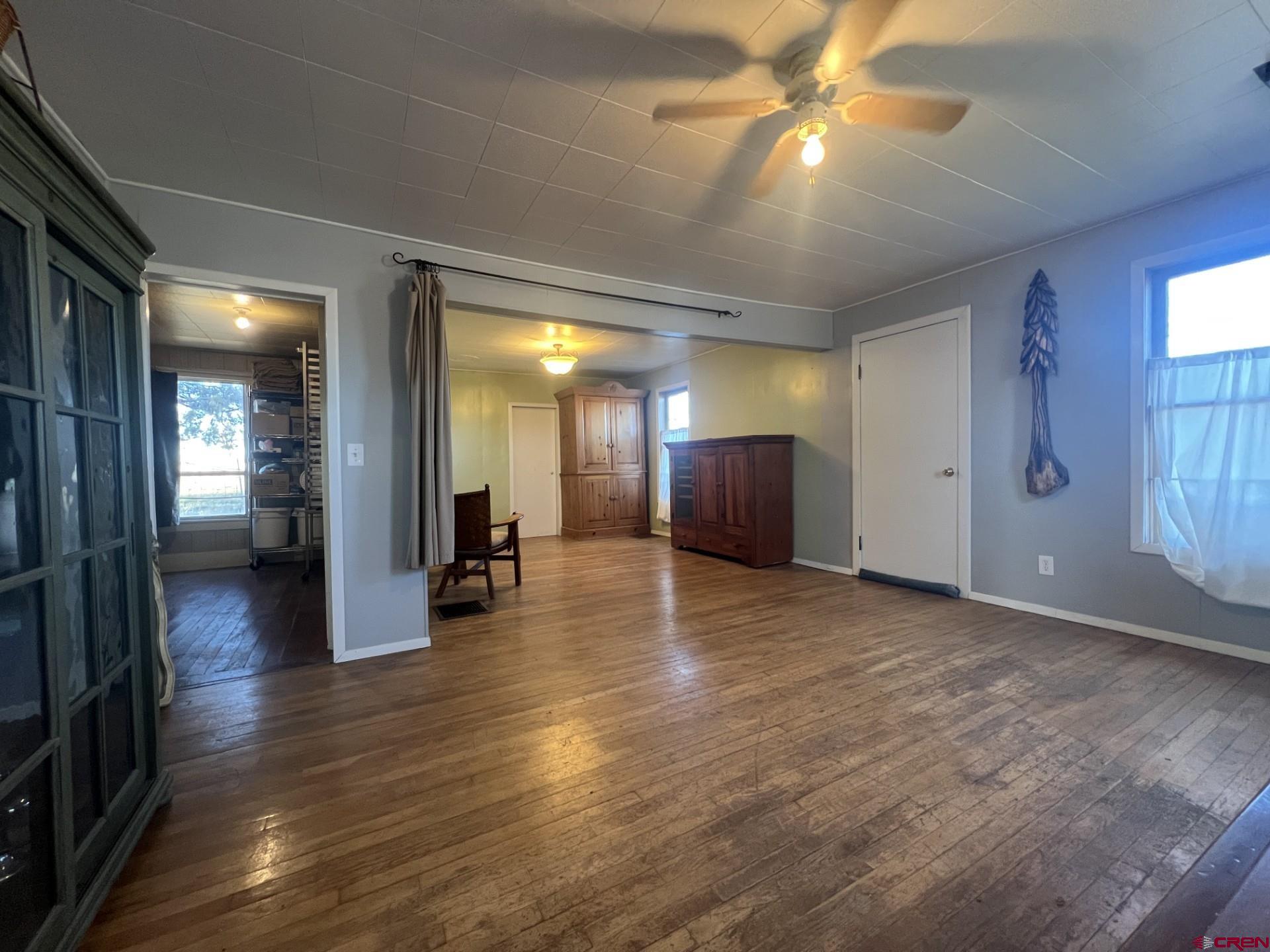 12363 Road 25 Cortez, CO 81321 - Photo 8 of 26 a view of a hallway with wooden floor