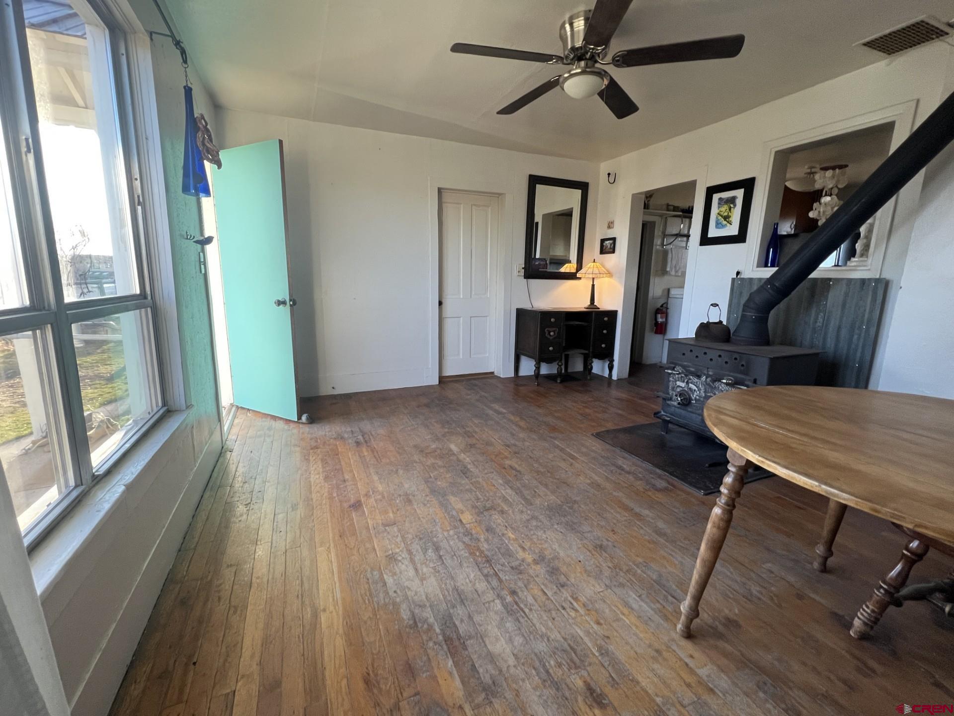12363 Road 25 Cortez, CO 81321 - Photo 10 of 26 a view of a livingroom with furniture and a ceiling fan