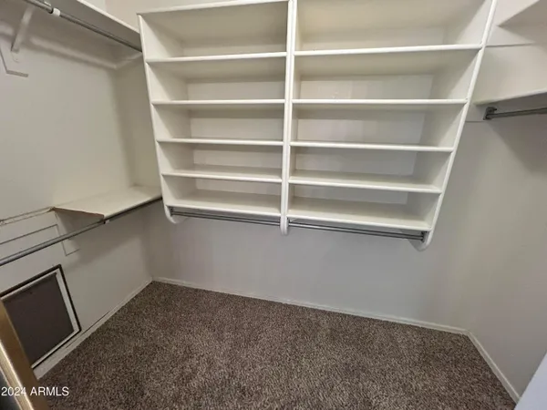 a view of an empty room and a window