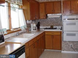 917 Longstreth Road Warminster, PA 18974 - Photo 6 of 6 a kitchen with a sink and cabinets