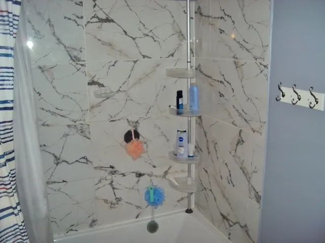 a view of a backyard with table and chairs and potted plants