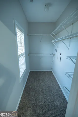 a view of a room that has a window