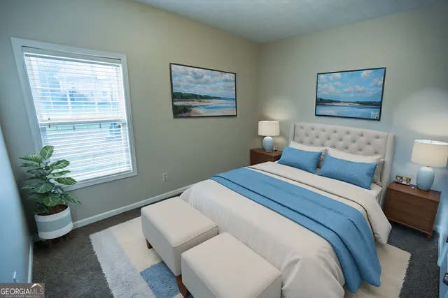 a bedroom with bed and a couch