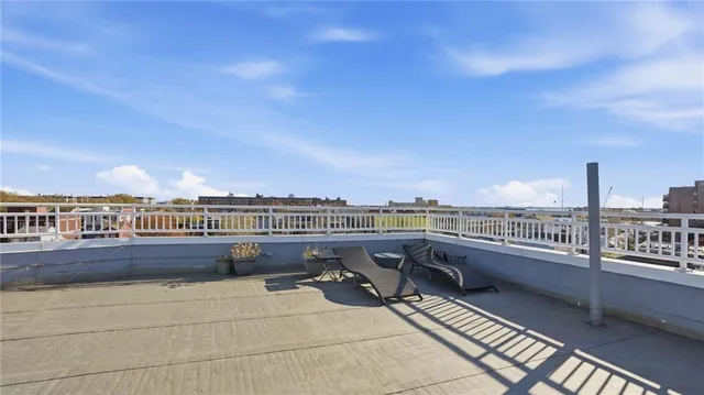 a view of a city skyline from a balcony