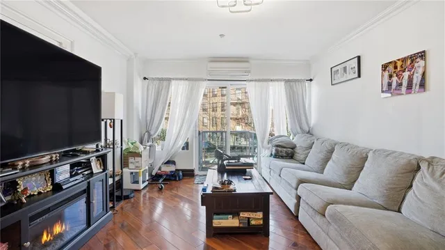 a kitchen with stainless steel appliances granite countertop a refrigerator a stove and a sink