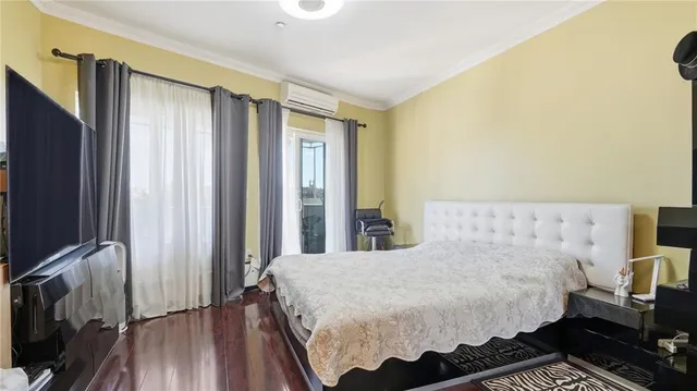 a bathroom with a bathtub sink mirror vanity and toilet