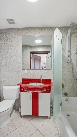 a bathroom with a toilet and a sink