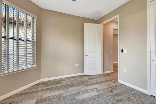 a bathroom with a granite countertop sink a toilet and bathtub