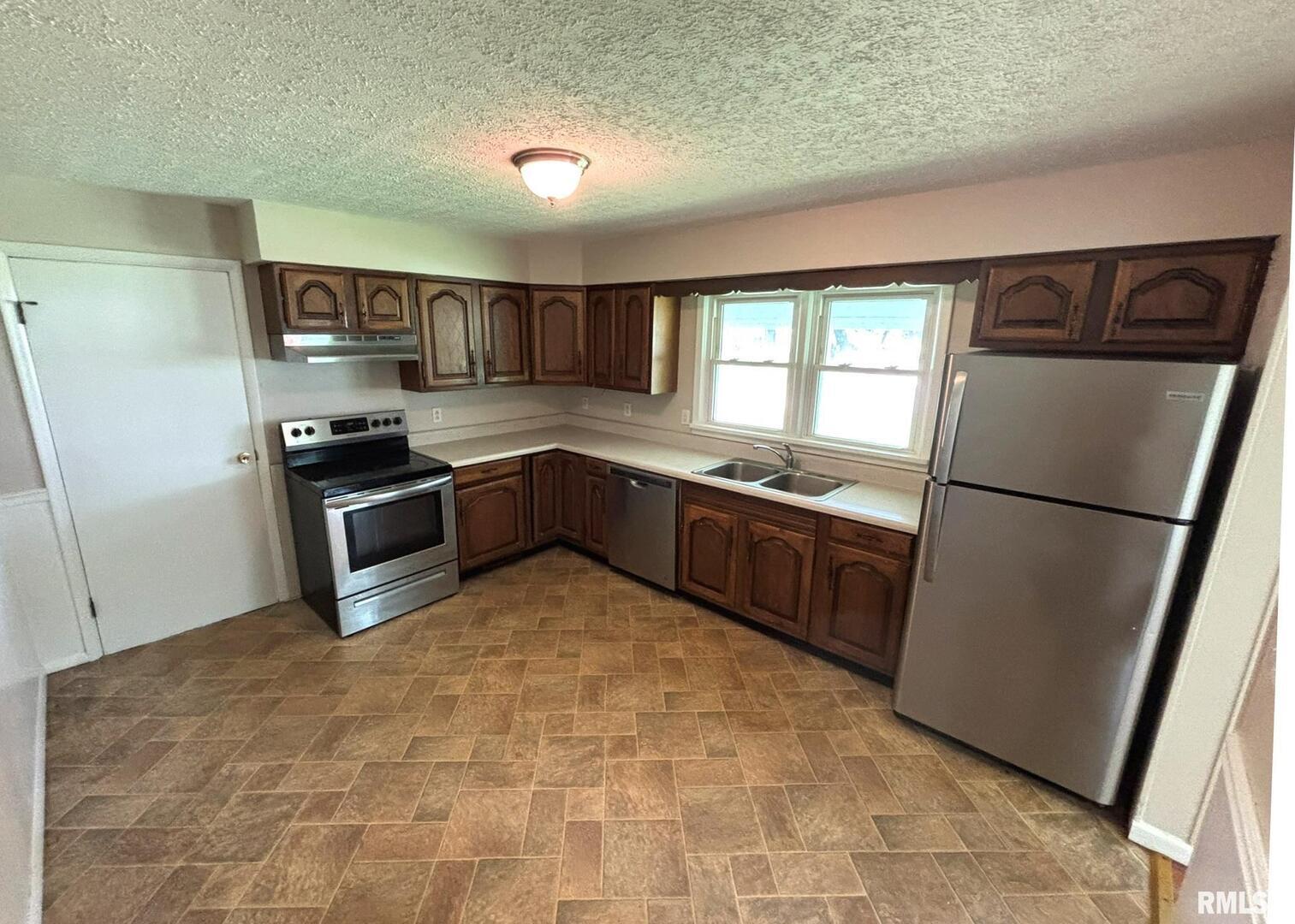 145 Hickory Grove Lane Salem, IL 62881 - Photo 7 of 20 a kitchen with stainless steel appliances granite countertop a refrigerator a sink a stove a microwave and island