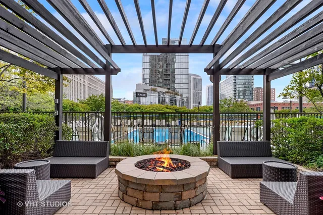 a view of a patio with a dining table and chairs