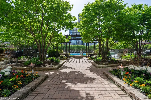 a view of a patio with table and chairs and potted plants