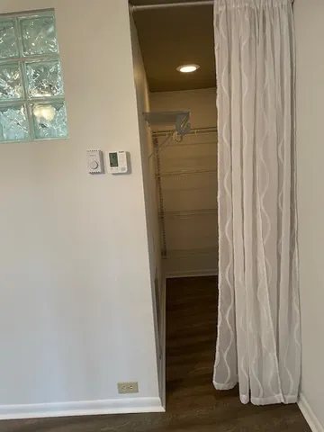 a view of entryway with wooden floor