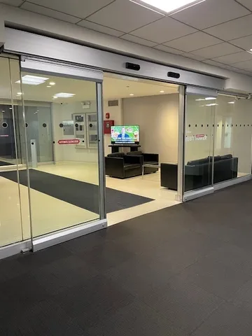 a lobby with furniture and a potted plant