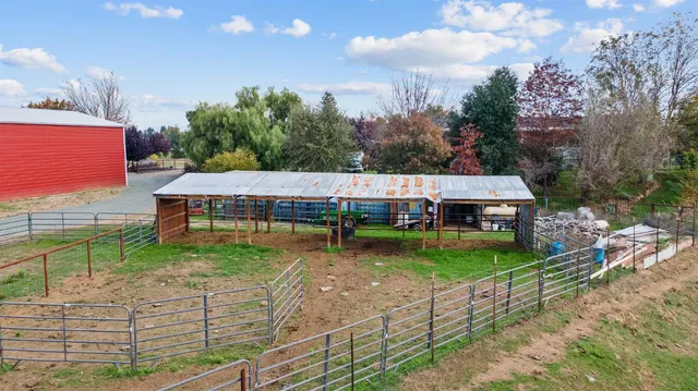 a view of a patio with a table and chairs