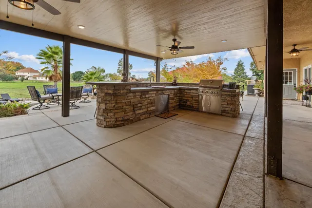 a living room with furniture wooden floor and a window