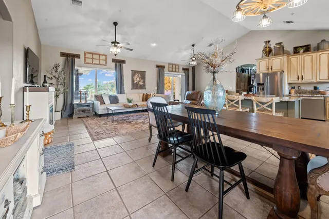 a bedroom with a bed and a flat tv screen on dresser