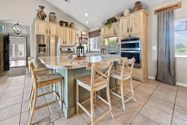 a bedroom with furniture and a chandelier