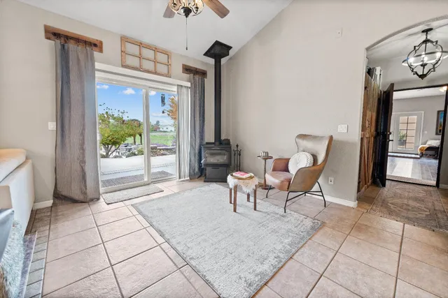 a view of a house with a patio and a yard