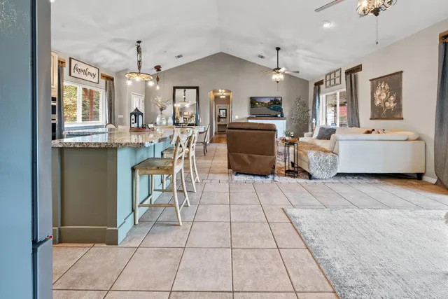 a view of a house with a yard and sitting area