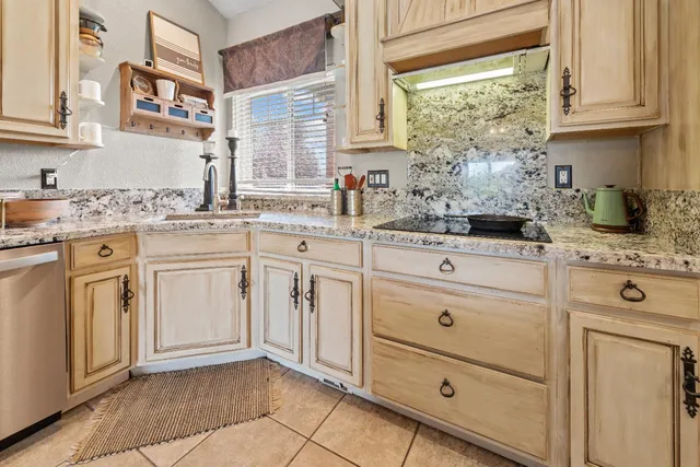 a view of a house with a yard and garage