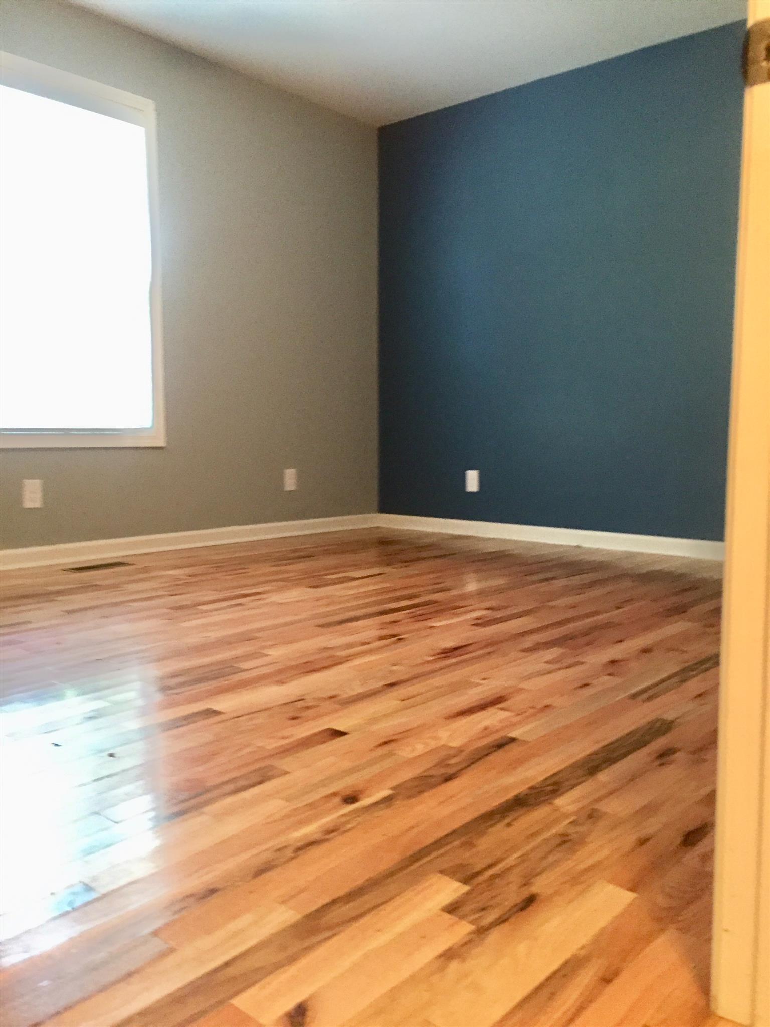 1615 Clay Street Springfield, TN 37172 - Photo 14 of 20 Master bedroom with nice flooring & lots of light gives an open clean feel!
