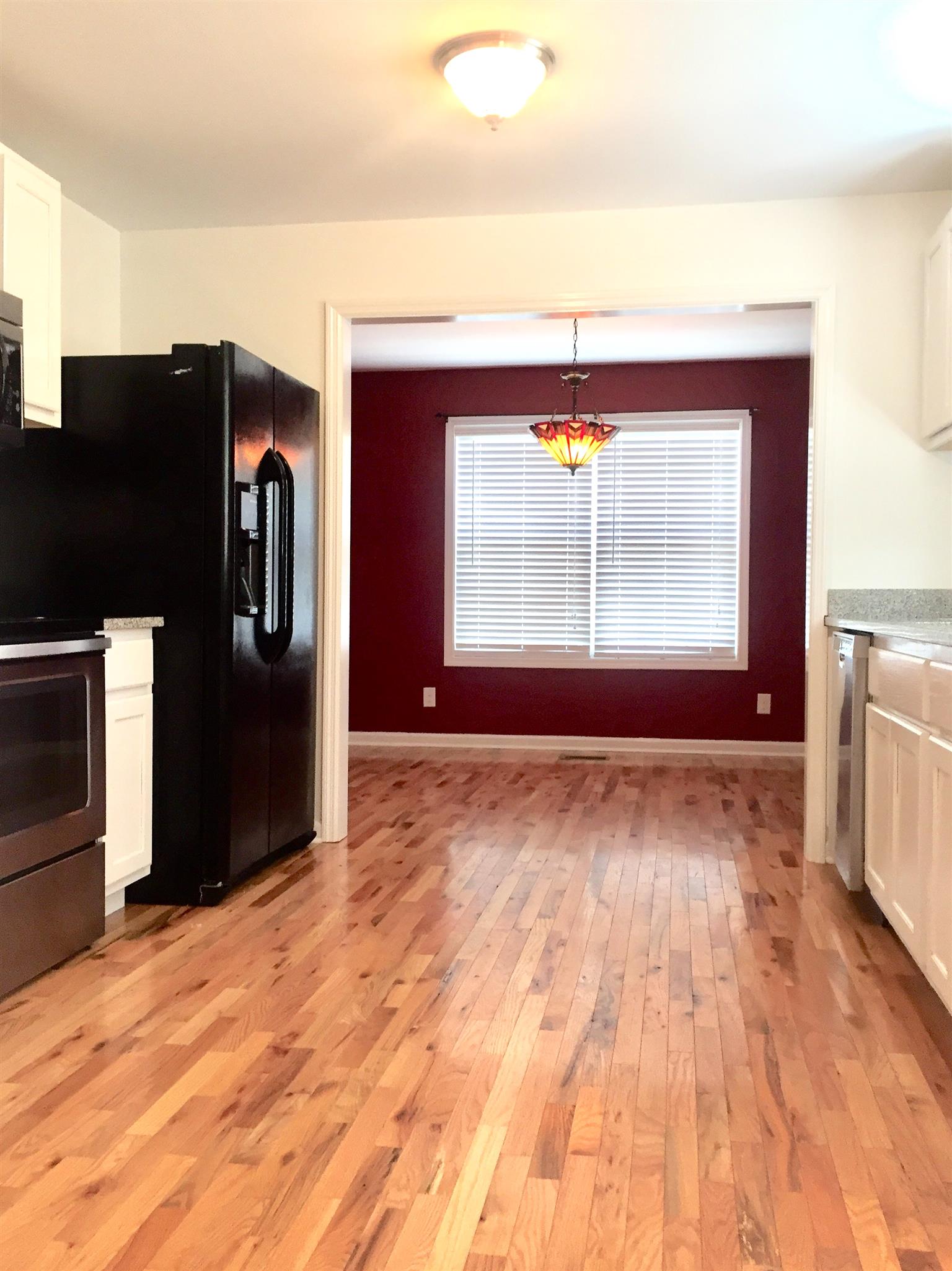 1615 Clay Street Springfield, TN 37172 - Photo 9 of 20 A great shot of the hard wood floor from the kitchen to the dining room!