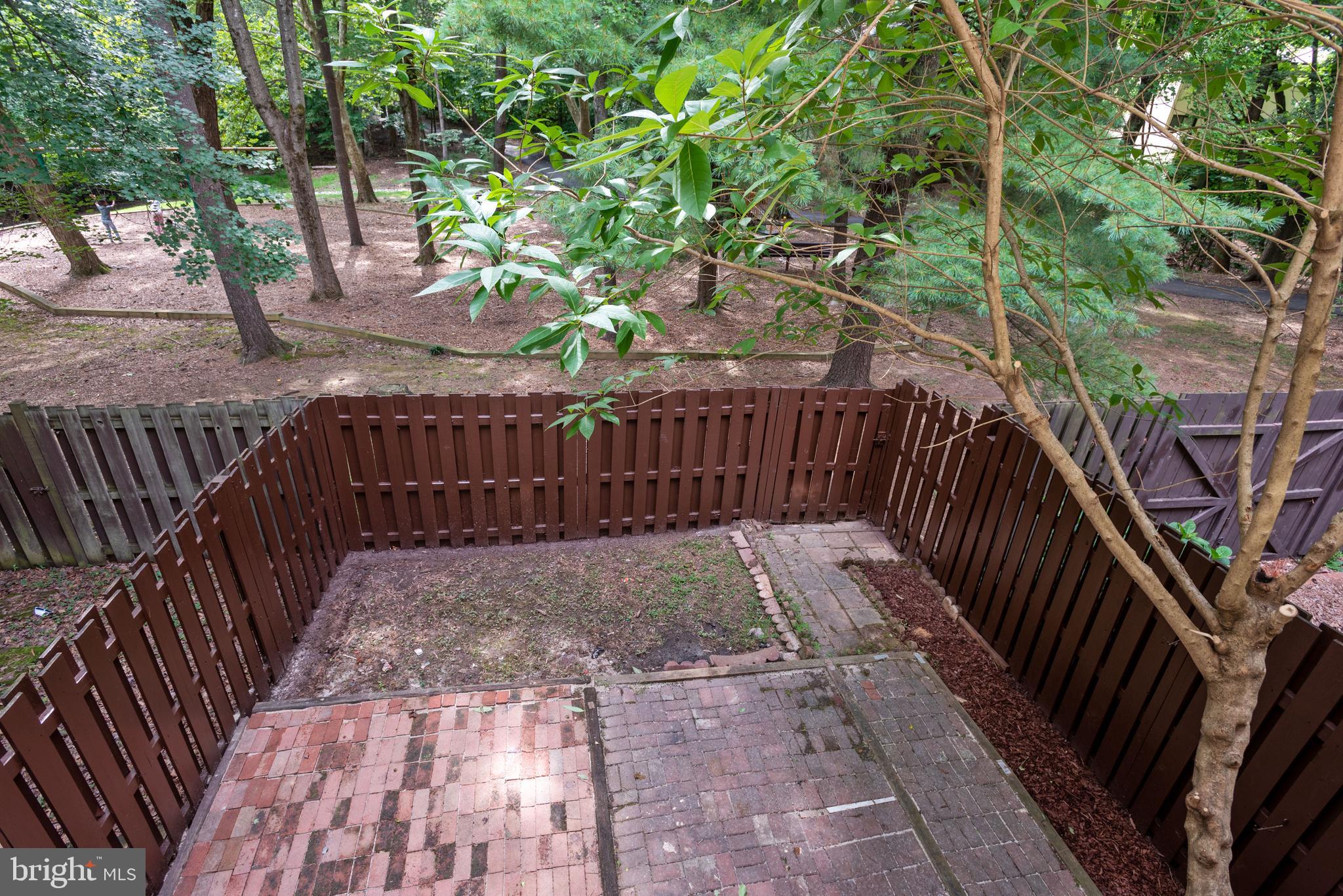 11841 Coopers Court Reston, VA 20191 - Photo 27 of 36 Fenced in yard backs to treed common area