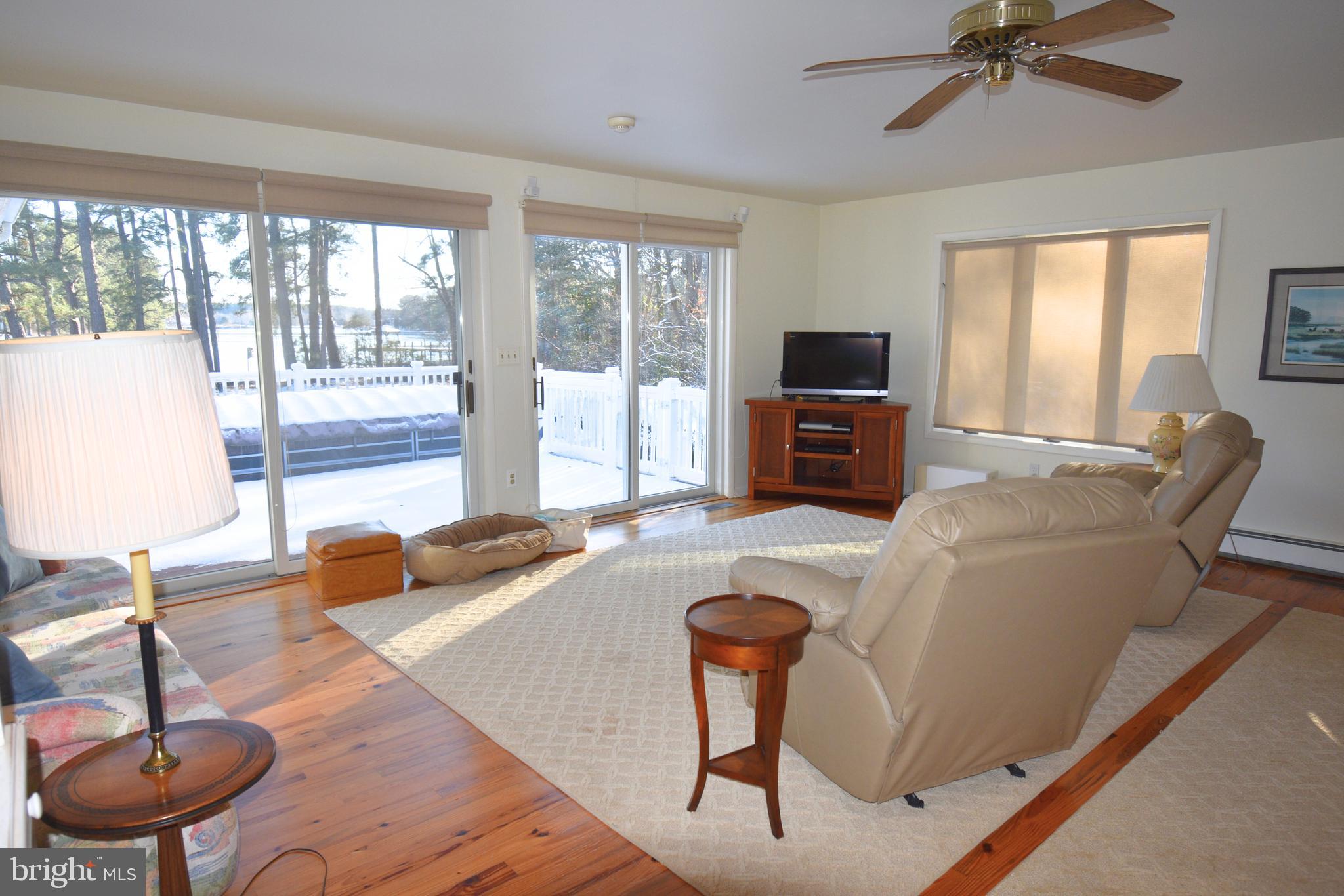 7361 Solitude Road St. Michaels, MD 21663 - Photo 15 of 23 a living room with furniture and a flat screen tv
