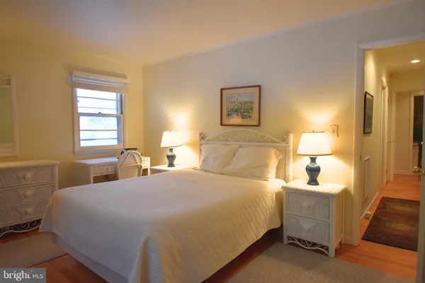 a bedroom with a bed and a table