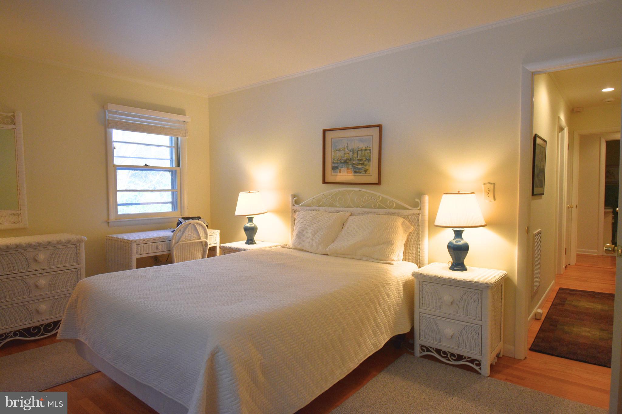 7361 Solitude Road St. Michaels, MD 21663 - Photo 16 of 23 a bedroom with a bed and a window