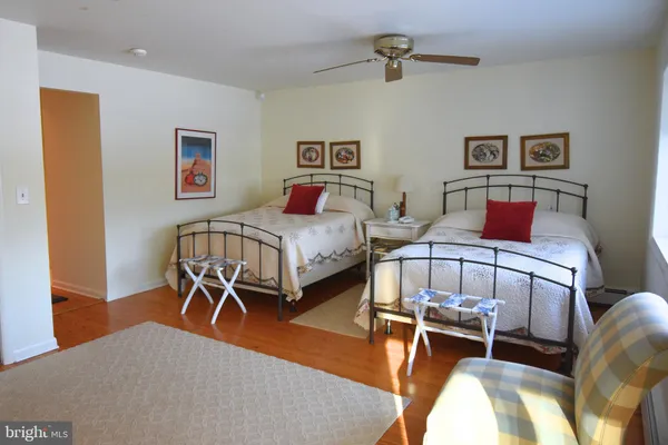 a bedroom that has a bed and a table in it