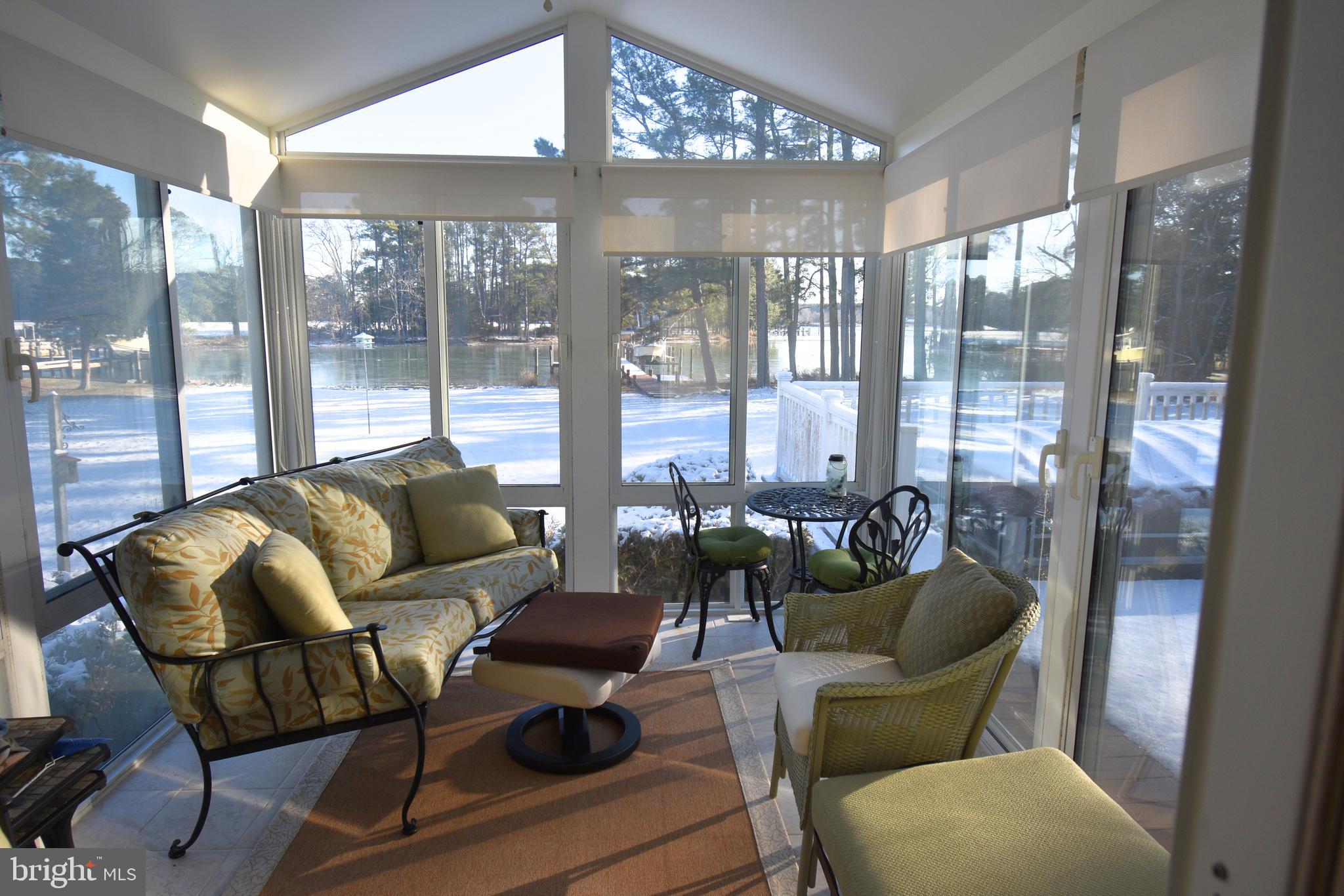 7361 Solitude Road St. Michaels, MD 21663 - Photo 21 of 23 a living room with furniture and a large window