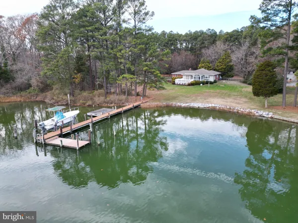 a view of a lake in between two chairs