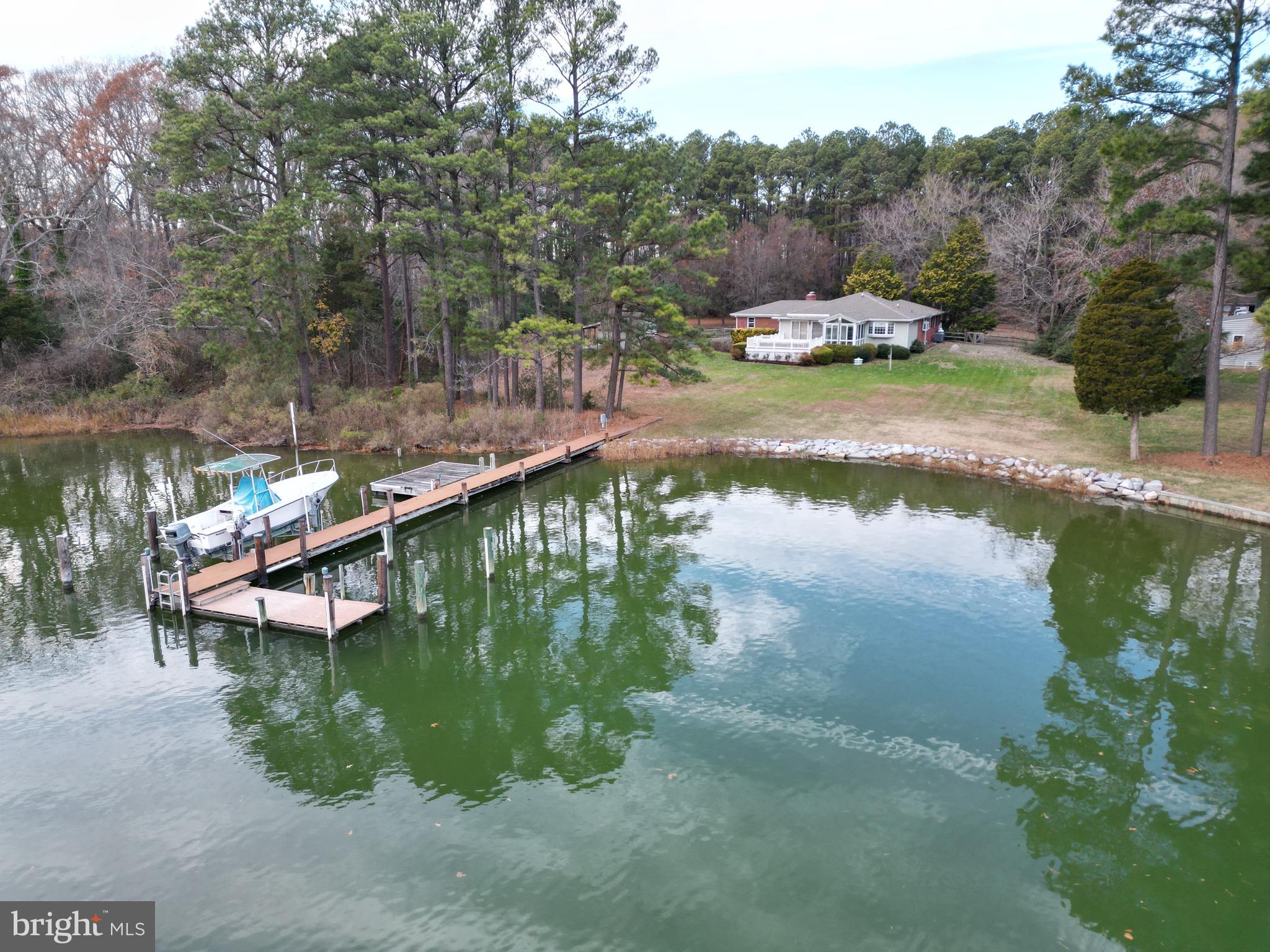 7361 Solitude Road St. Michaels, MD 21663 - Photo 7 of 23 a view of a lake in between two chairs