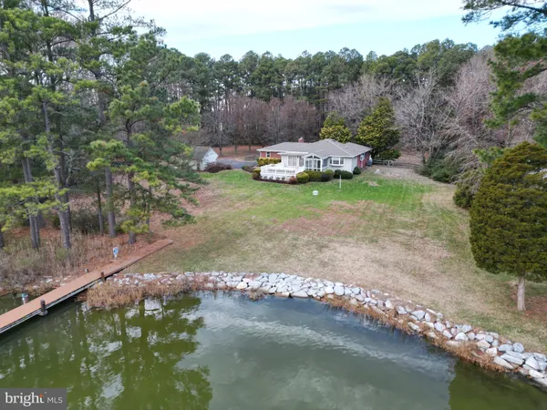 a view of a lake with a yard