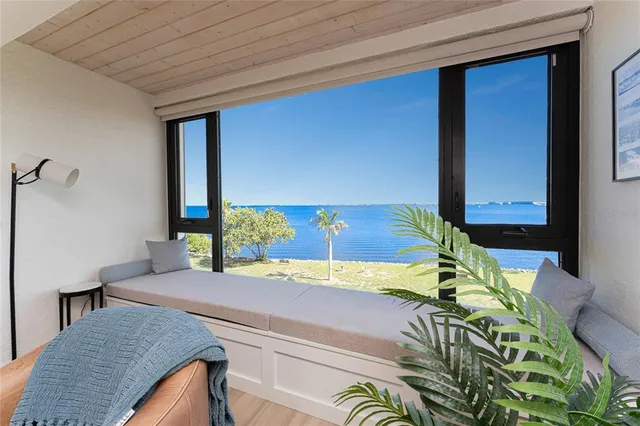 a living room with a bed