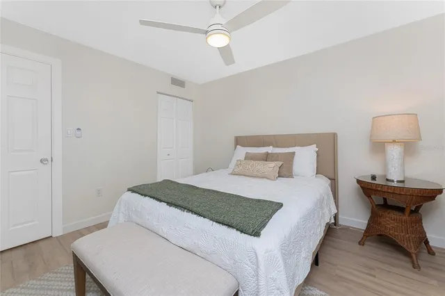 a bedroom with a bed and a table