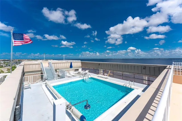 a view of a balcony with dining table