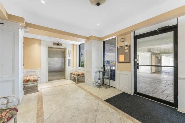 a spacious bathroom with a glass shower door and a mirror