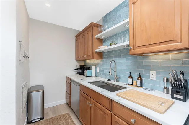 a kitchen with a sink and cabinets