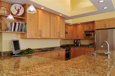 134 Salten Point Road Barnstable, MA 02630 - Photo 6 of 18 a kitchen with stainless steel appliances granite countertop a granite counter tops a stove a sink and a refrigerator