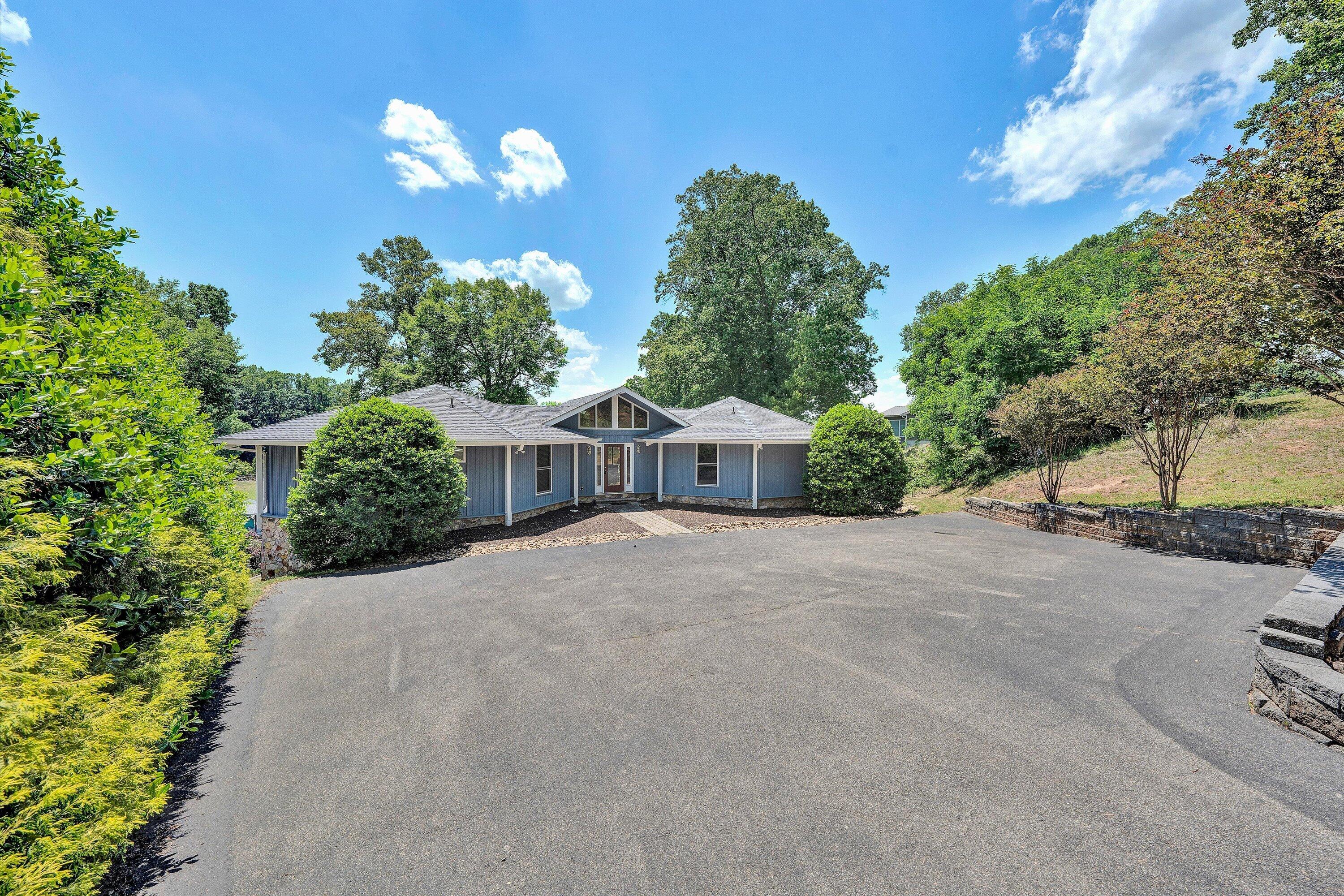 207 Winding Way Union Hall, VA 24176 - Photo 53 of 60 a front view of a house with a yard and a garage