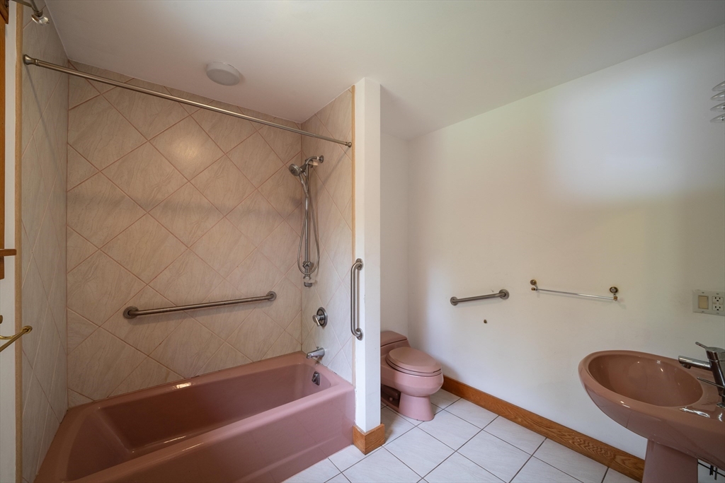 184 W Road Bernardston, MA 01337 - Photo 22 of 41 a bathroom with a granite countertop bathtub shower sink mirror and toilet